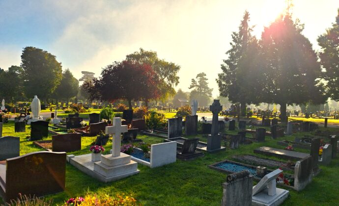 sunrise over dunstable cemetery with graves in background