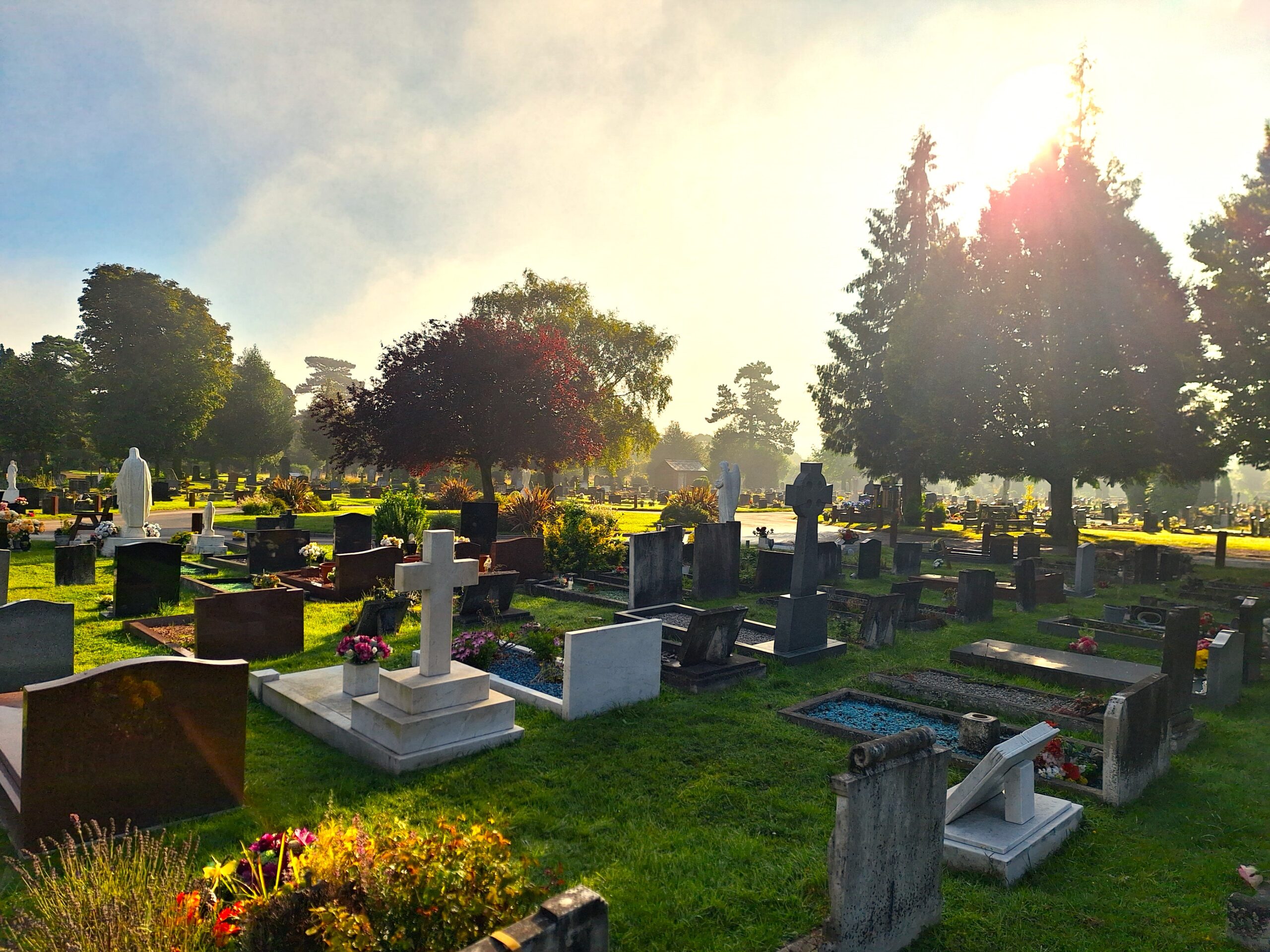 sunrise over dunstable cemetery with graves in background