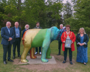 flame the elephant with people around it