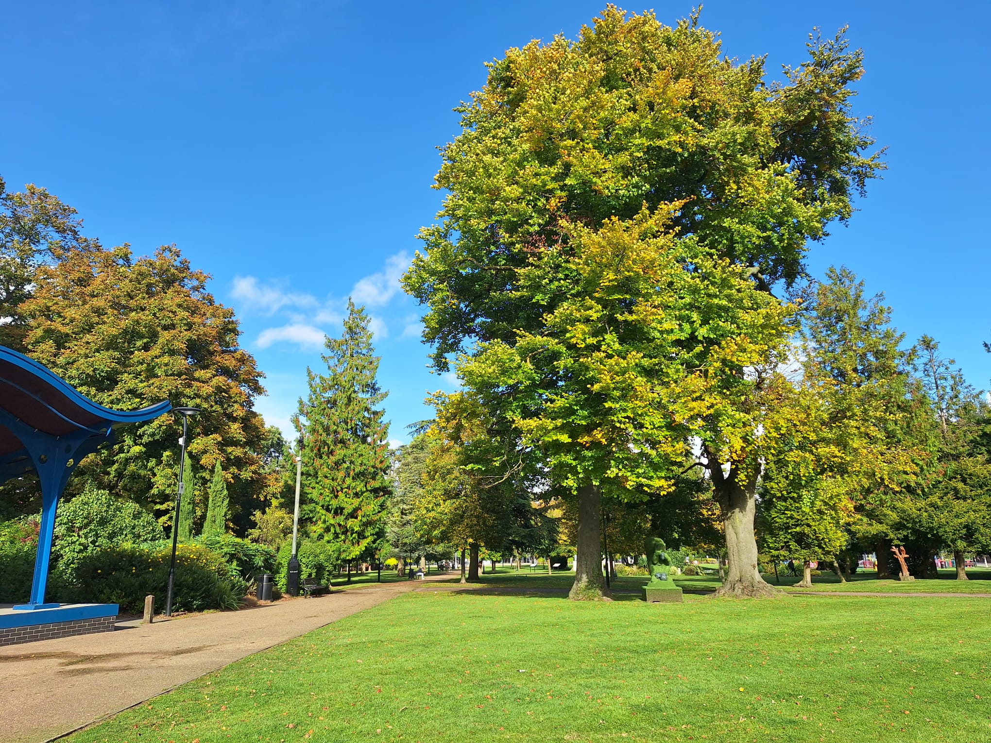grove house gardens pathway with trees in the back