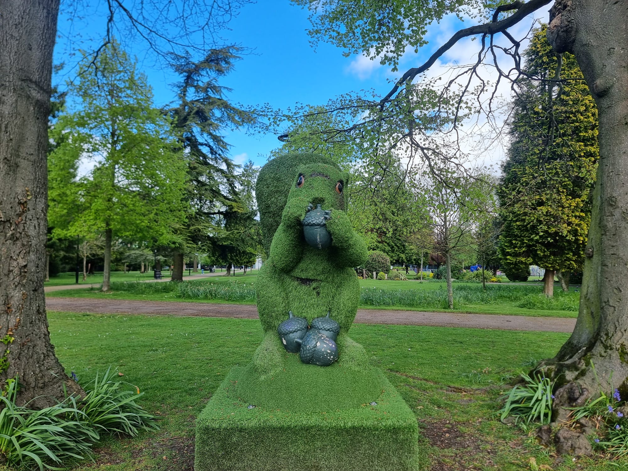 green squirrel in grove house gardens