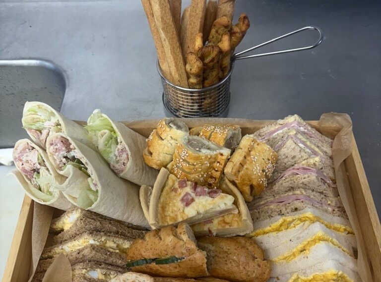 tray filled with sandwiches and wraps