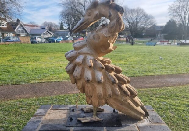 side profile of the swan jewel wooden sculpture