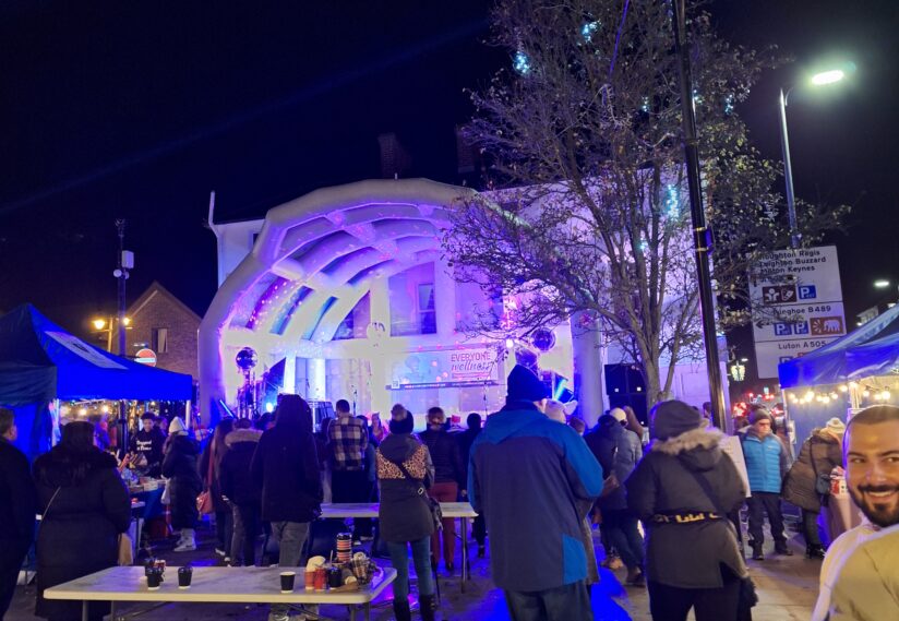 Twilight event with stage and people in The Square