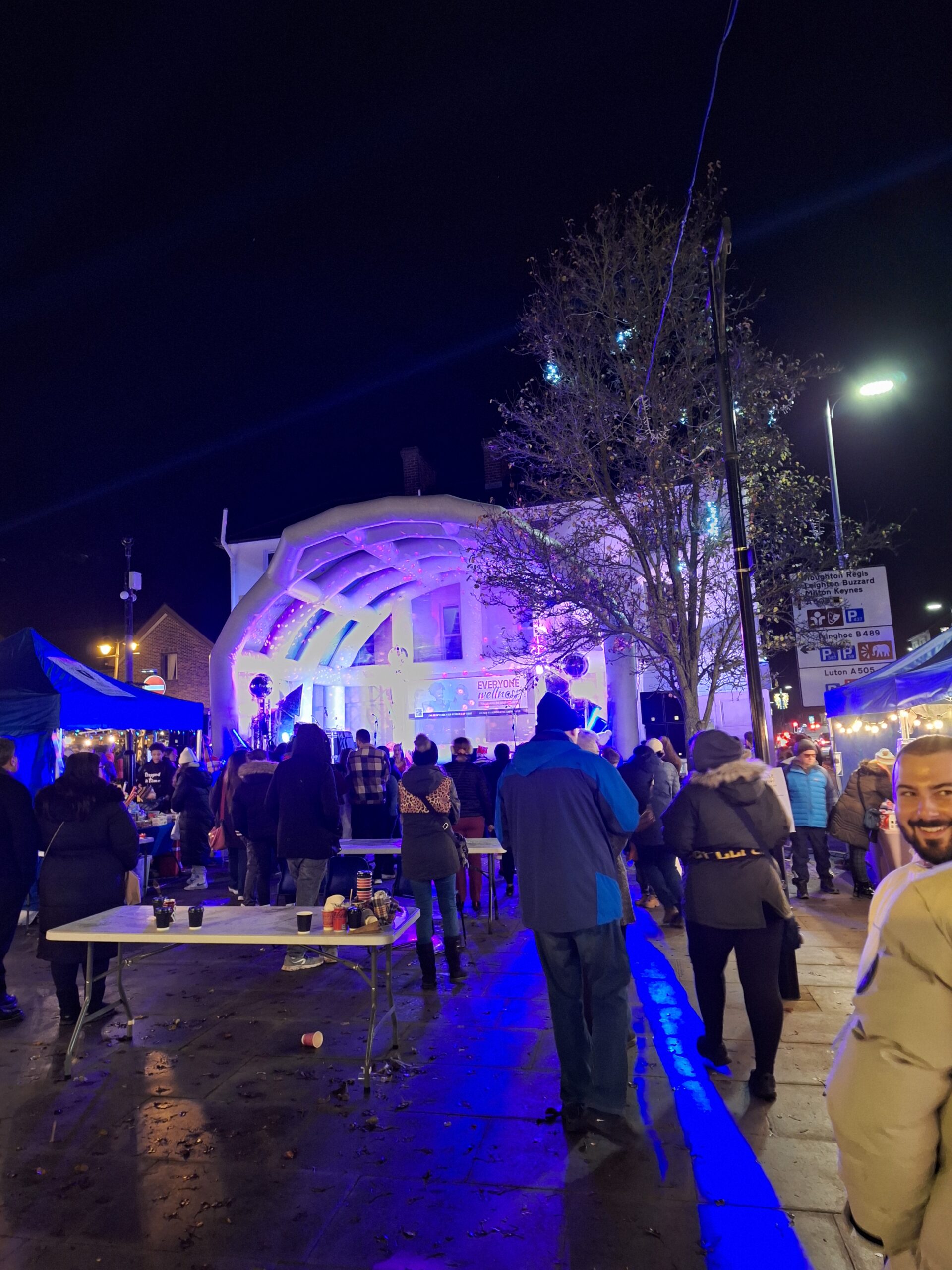 Twilight event with stage and people in The Square