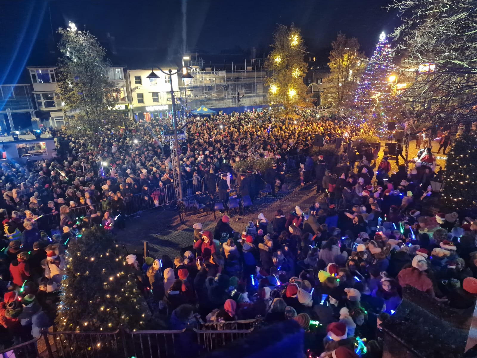 large crowds at the Torchlight event with the church in the background