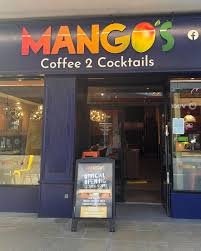 Storefront of Mango's, marked by colorful lettering. Sign reads 
