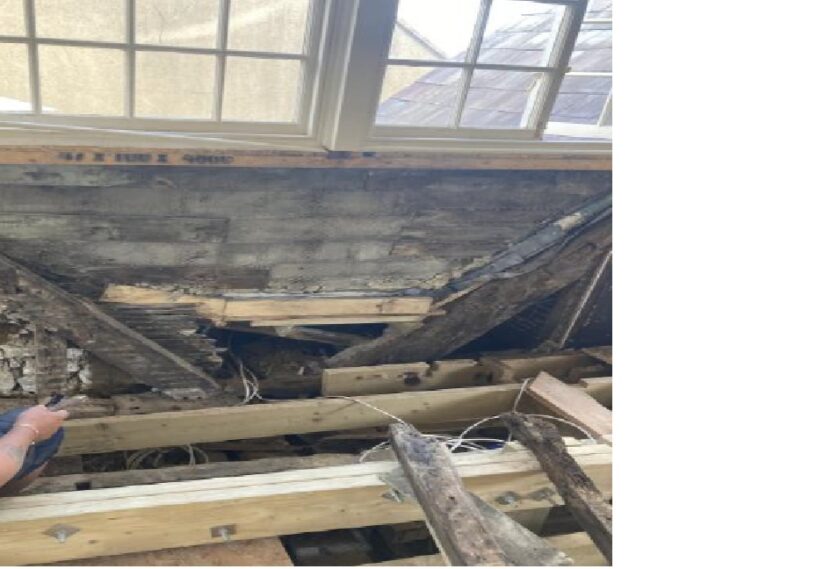 Priory House second floor attic room apex window, with evidence of previous roof line.