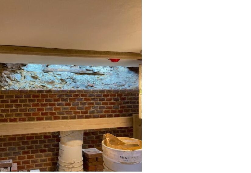 Priory House- bricking up new structural wall on ground floor.