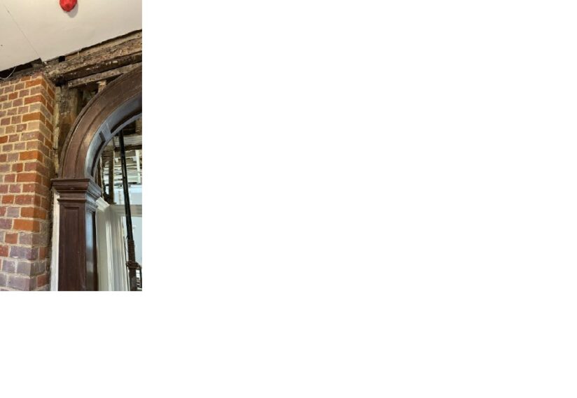 First floor hall way rebuilding of wall next to archway.