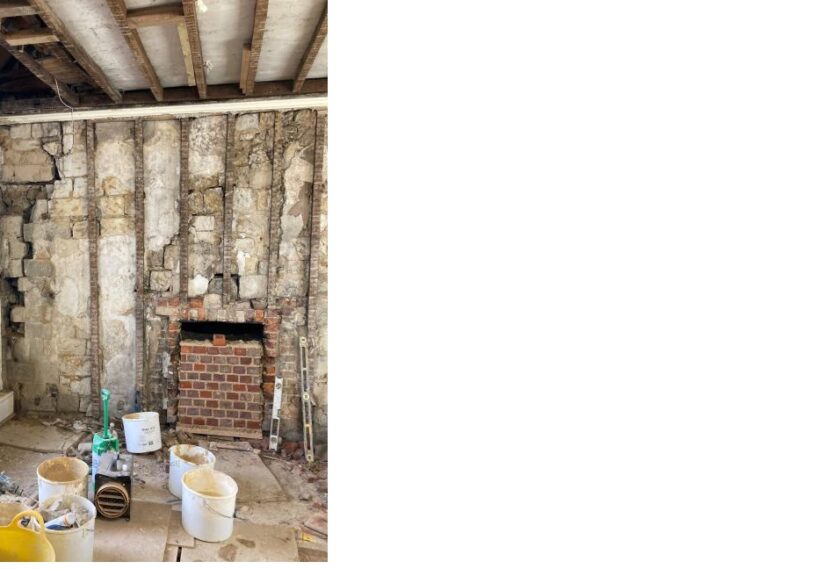 Evidence of displacement of internal north wall and external West wall with bricking up of fire place.