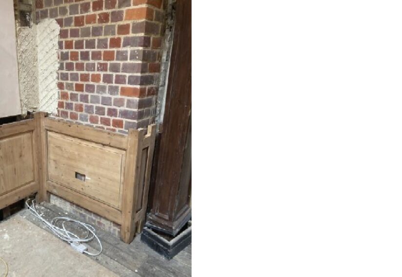 Priory House first floor landing, rebuilding of wall in brick with wooden paneling