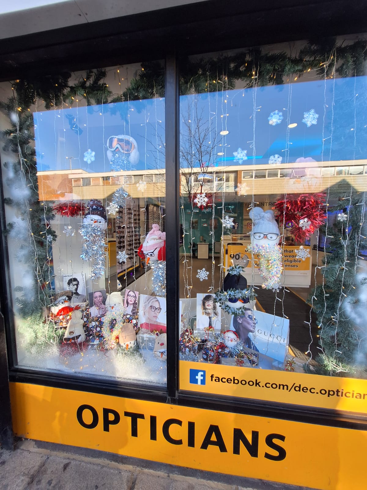 Dunstable Eye Centre Christmas Window with snowman and presents in the window