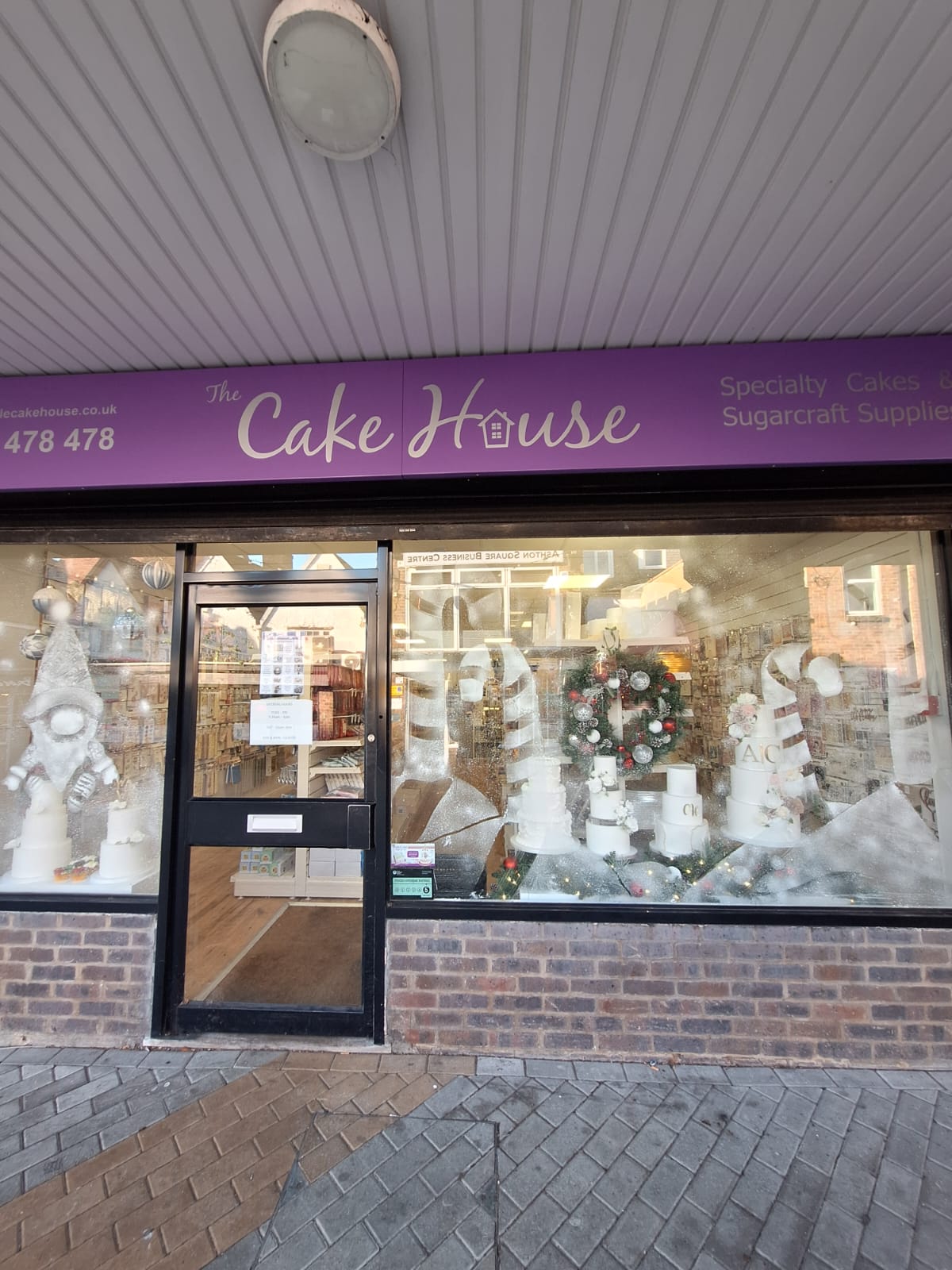 Dunstable Cake House Christmas Window with snow decorations in the window