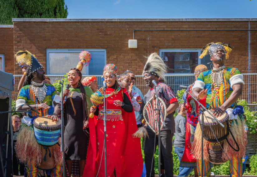 5 people dressed in vibrant colours, 2025 Screenshot