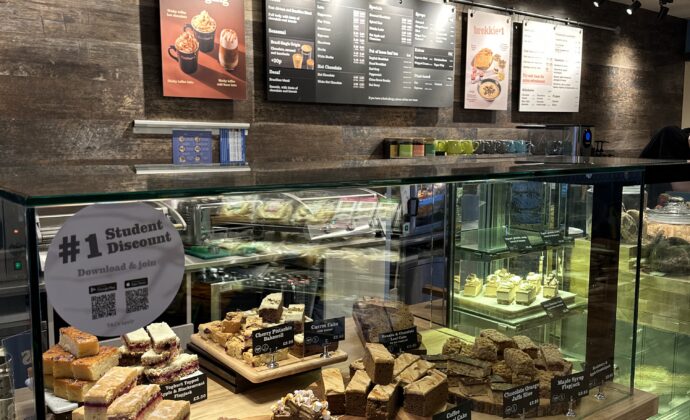 inside the shop of Coffee#1. Cakes at the counter