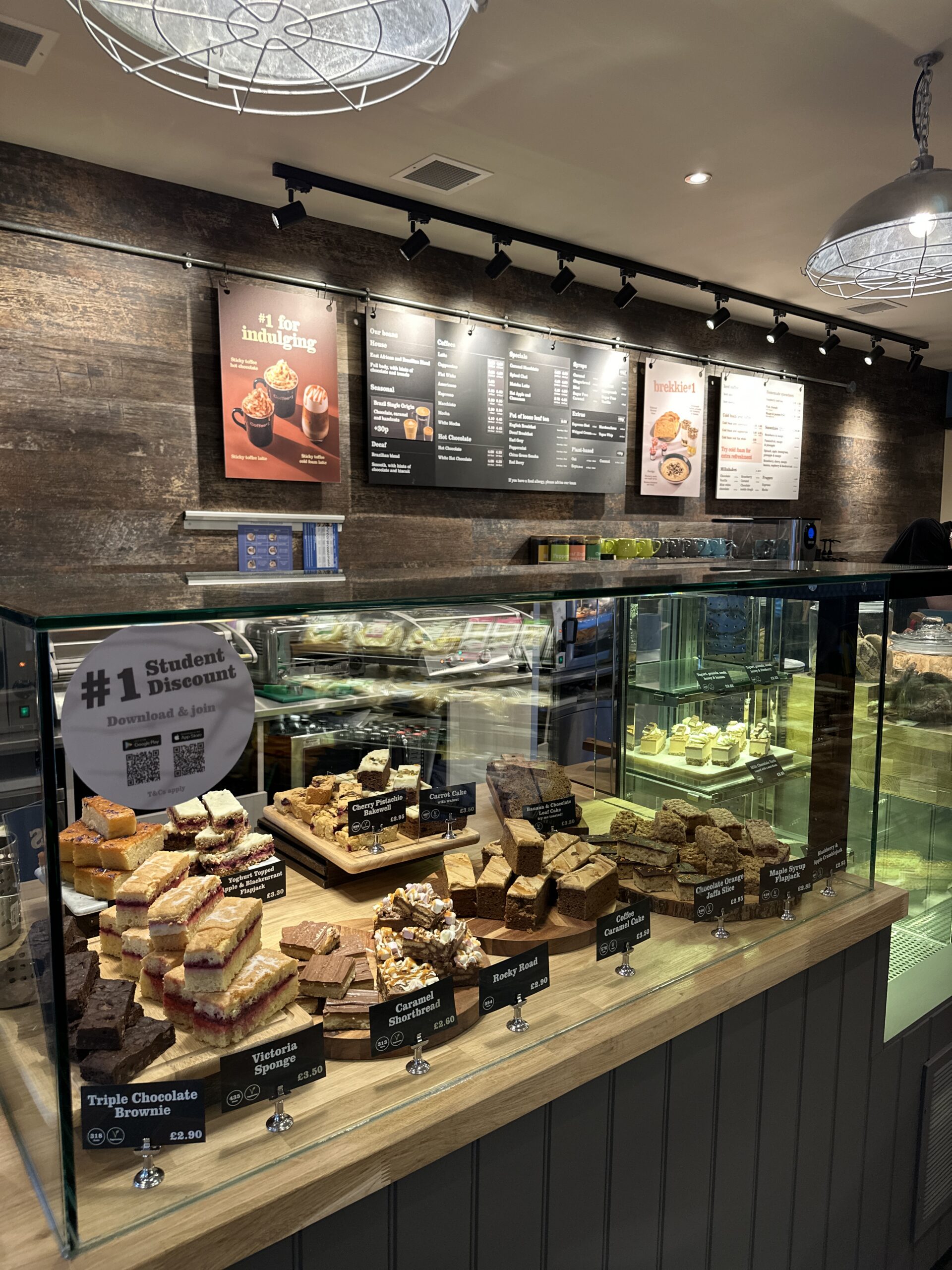 inside the shop of Coffee#1. Cakes at the counter