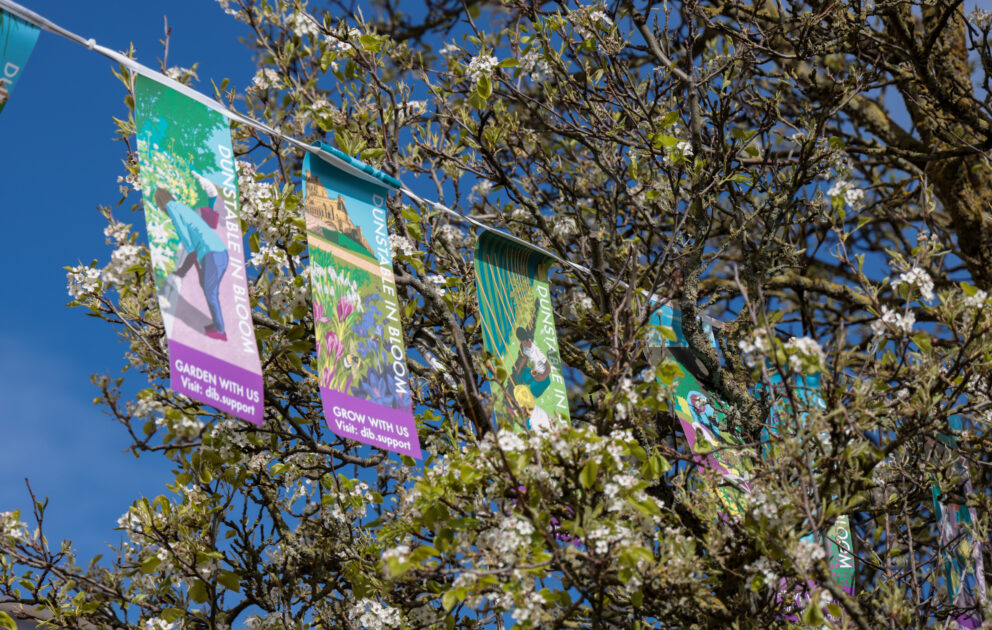 Banners with floral designs and gardening themes, marked 