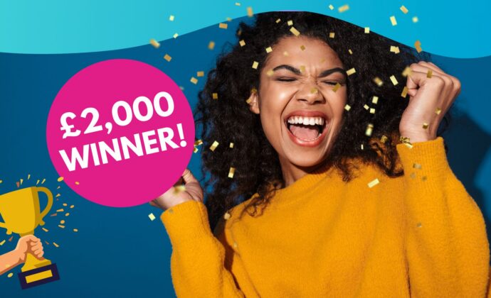 Cheerful woman in yellow sweater celebrates winning £2,000. Confetti is falling, and a pink circle and trophy icon enhance the festive mood.