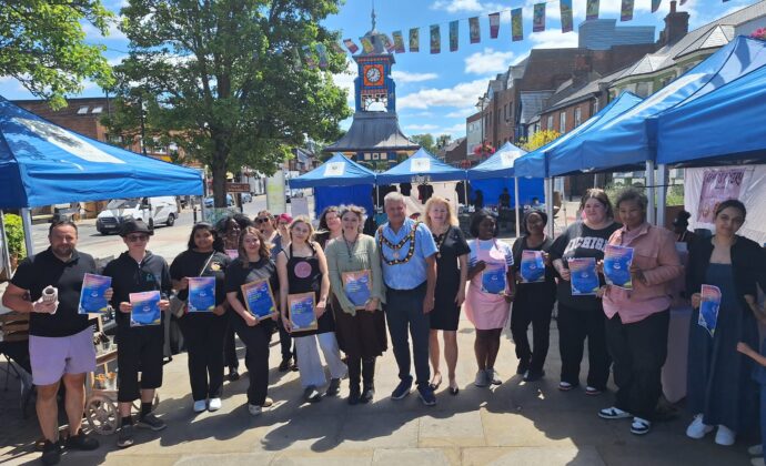 all young traders standing with certificates