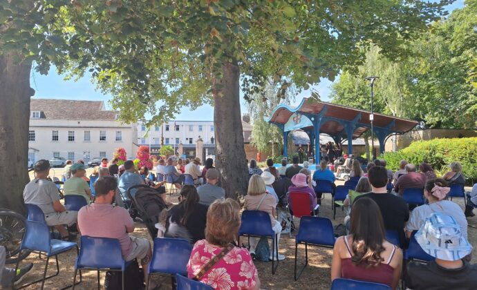 people watching performance on the band stand